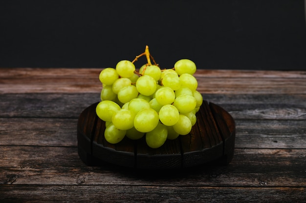 White grapes on a wooden board