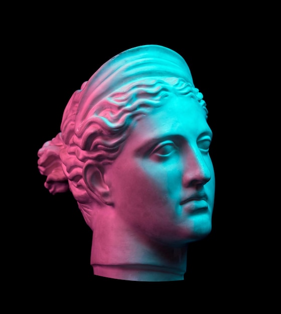 White gypsum copy of ancient statue of Diana head for artists on a black background. Plaster sculpture of woman face. Diana in Roman mythology the goddess of nature and hunting. Toned green and purple