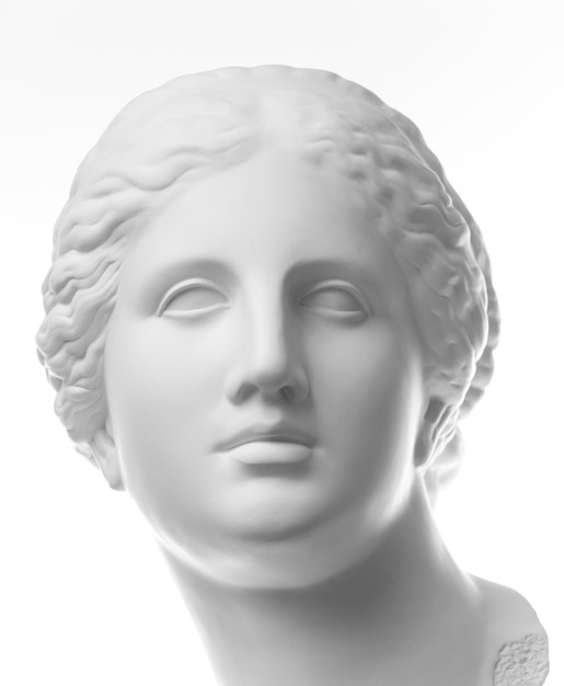 White gypsum copy of ancient statue of Venus de Milo head for artists isolated on a white background. Plaster sculpture of woman face.