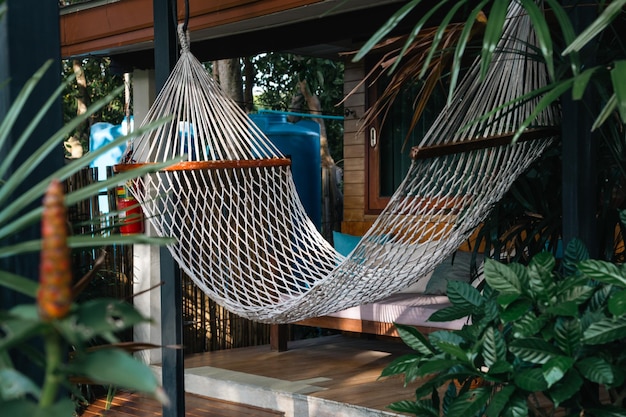 White hammock made of netting hanging in