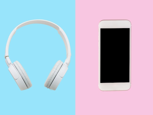 Photo white headphone smartphone on blue and pink background