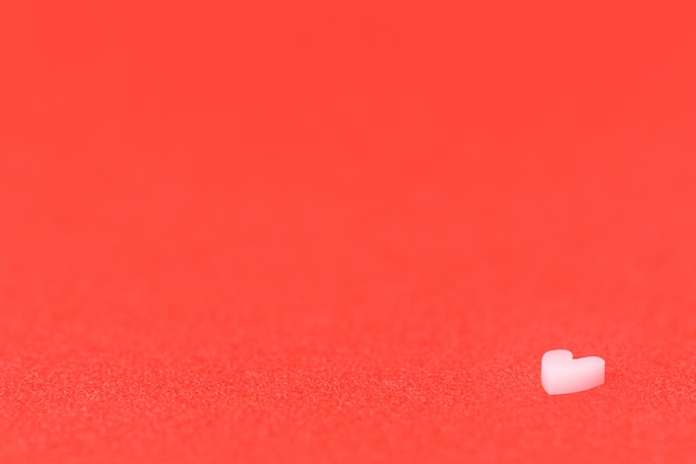 White heart on a red glittering paper. Love Valentines Day concept.