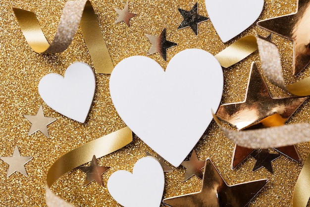 White heart shape on a golden glitter backgrond