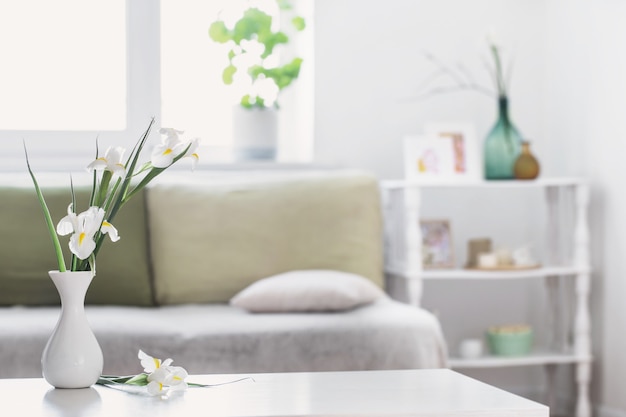 White home interior with spring flowers and decorations