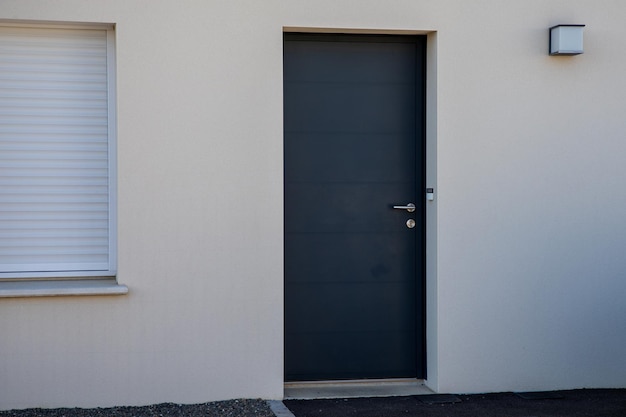 White house facade entrance grey door modern of street suburban home