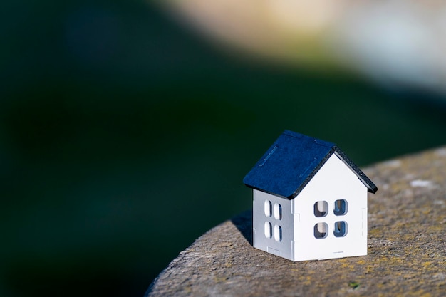 white house with a black roof, for real estate, with space to place text