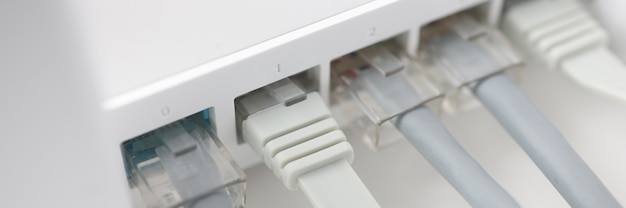 White internet router with connected wires choosing router for home and office concept