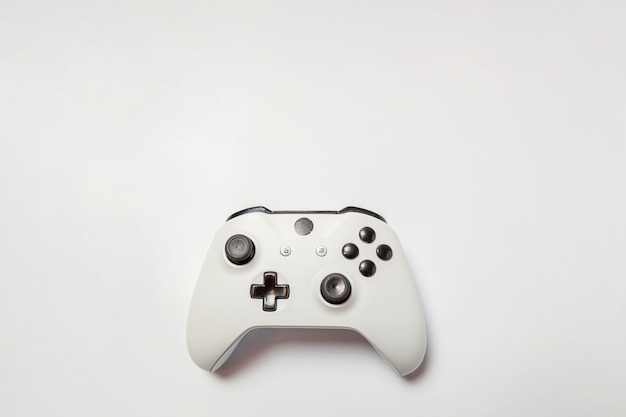 White joystick gamepad, game console isolated on white background. Computer gaming videogame concept