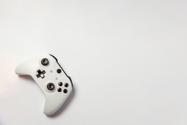 White joystick gamepad, game console isolated on white background. Computer gaming videogame concept