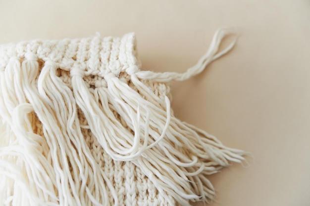 White knit scarf with tassels Close