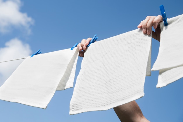 White laundry hanging on a string outdoors