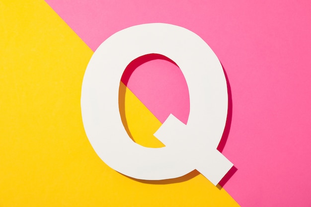 White letter Q on two-color background