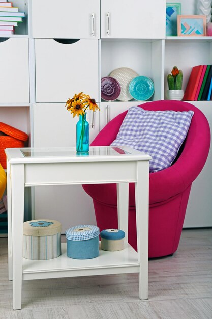 White living room with armchair and bookcase