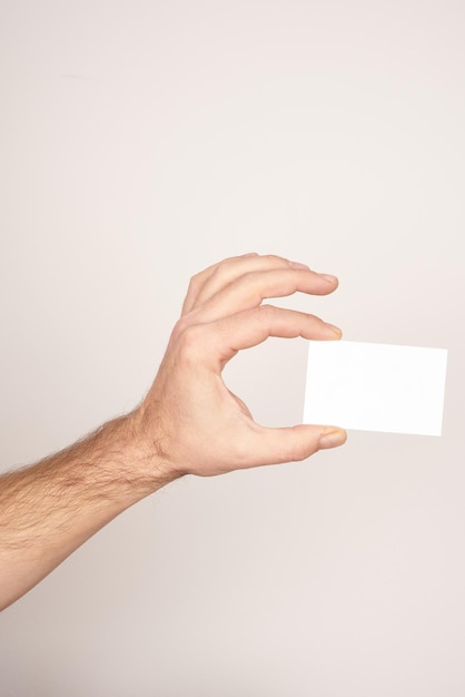 White male hand making a peace sign on a white isolated background.