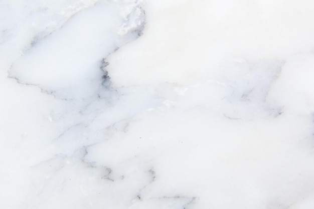 A white marble background with a grey and white marble texture.