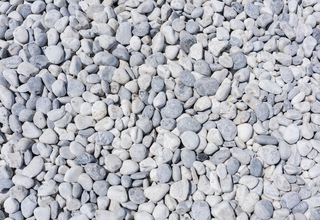 White marble stones on artificial marble beach for background