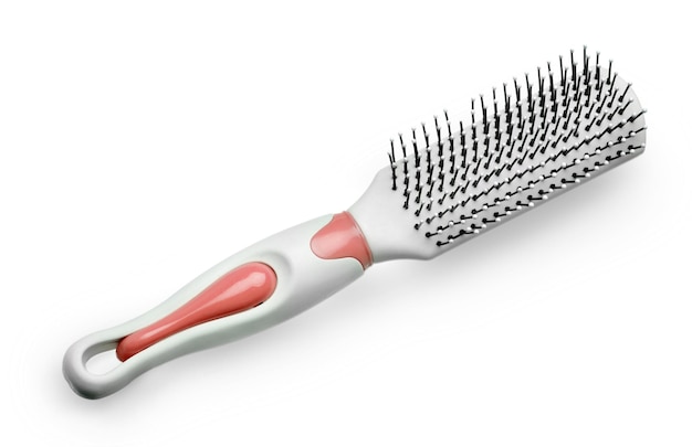 White massage plastic comb isolated on the white background