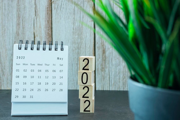 White May 2022 calendar with wooden block. 2022 New Year Concept