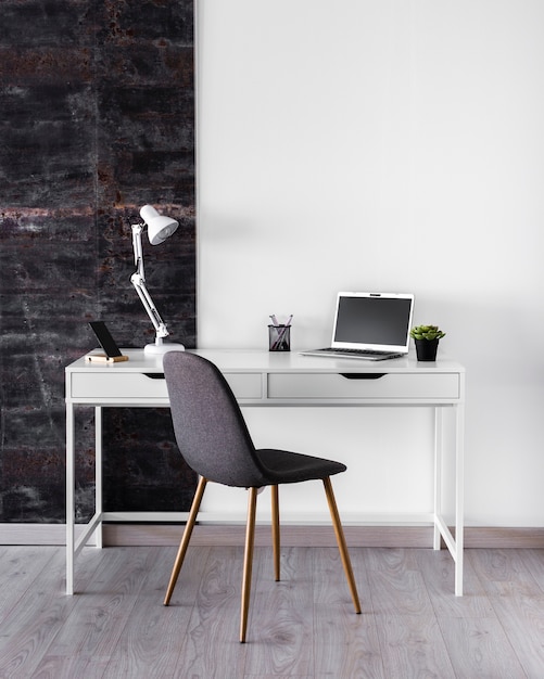 White metallic desk concept with lamp