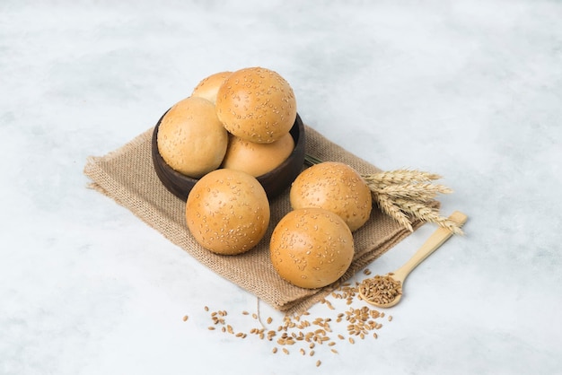 White mini breakfast italian bread on table cloth composition white background