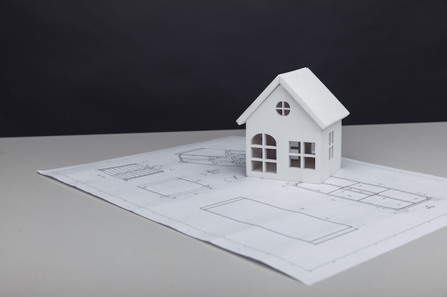 White model of house on drawing