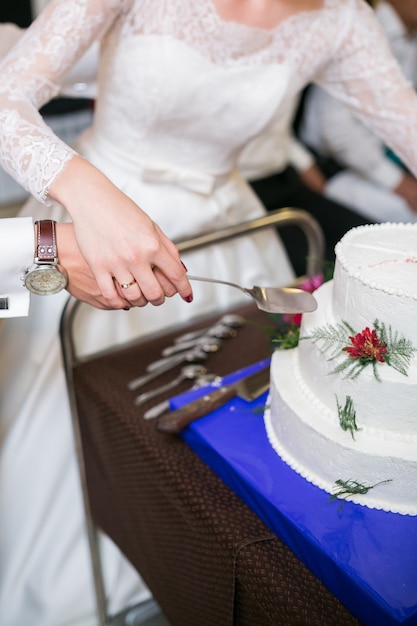 White multi level wedding cake with flower decorations