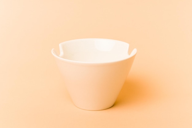 White noddles bowl isolated on beige background