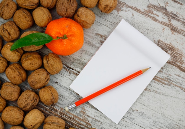 White notebook and fruit