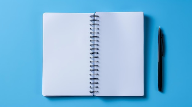 a white notebook with a blue background and a spiral bound notebook