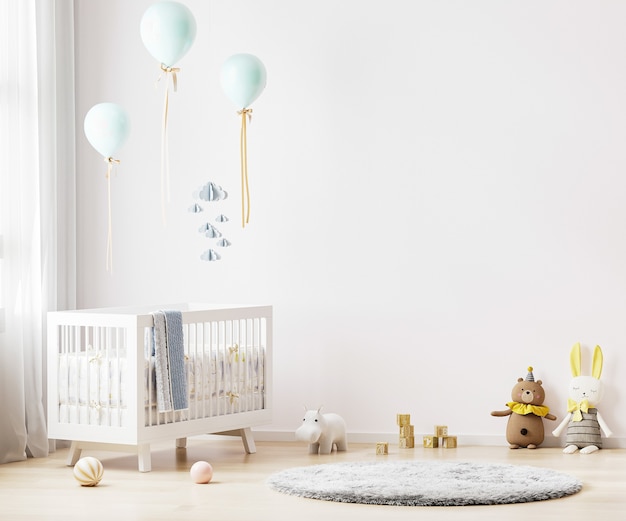 White nursery room interior background with baby bedding, toys