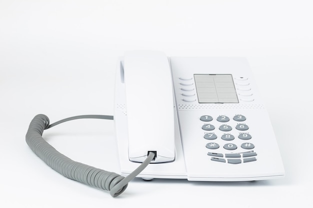 White office desk phone isolated on white