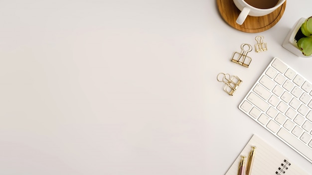 White office desk table. Flat lay.