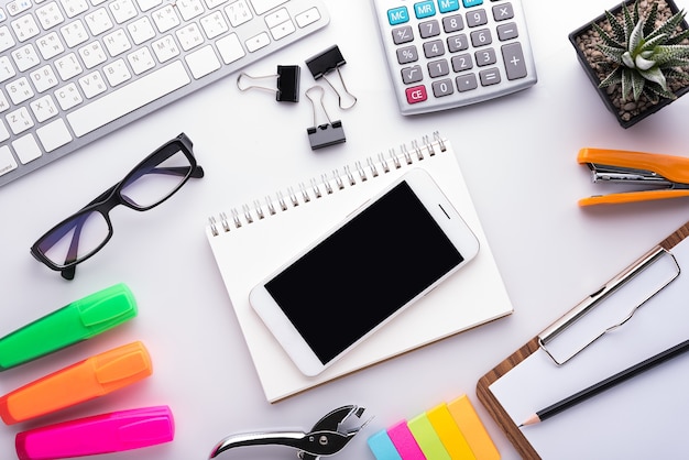 White office desk table with school accessories