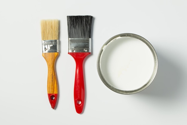 White paint and paint brushes