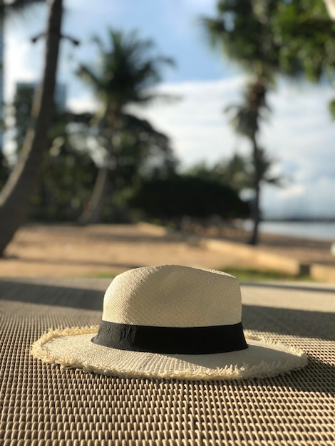 White Panama hat on wooden table