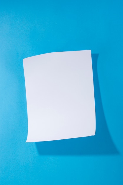 White paper on a blue background for decoration, for text design, for a template