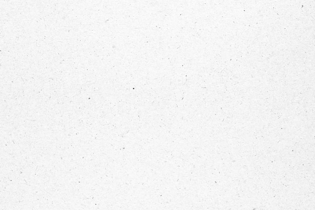 White paper or cardboard texture with black spot background.