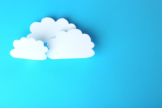 White paper clouds on blue background Cloud computing concept