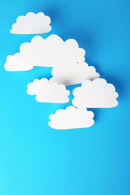 White paper clouds on blue background Cloud computing concept