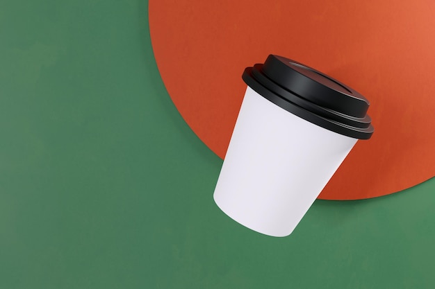 White paper cup of coffee on red and green background