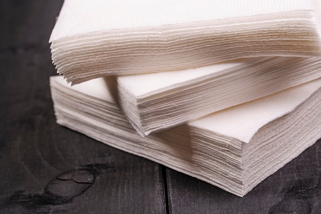 white paper napkin on old black wooden table