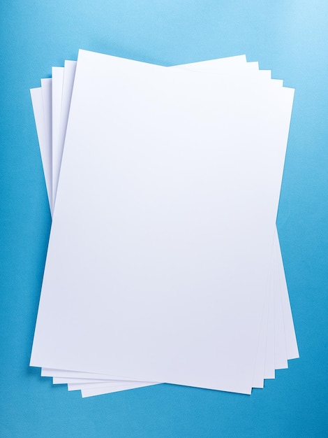 White Paper sheet background isolated on blue close up