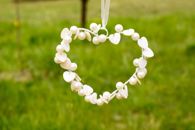 White pearls heart shape sign 