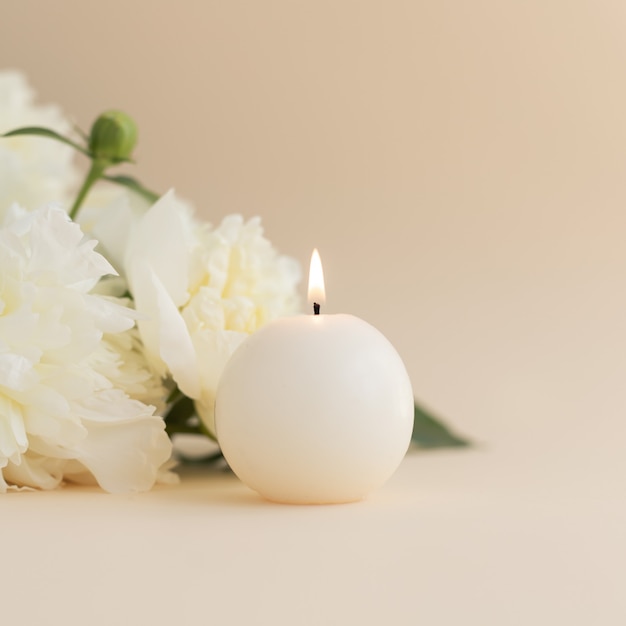 White peonies and aroma candles