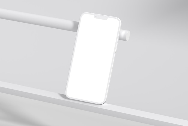 A white phone with a blank screen is placed on a shelf.