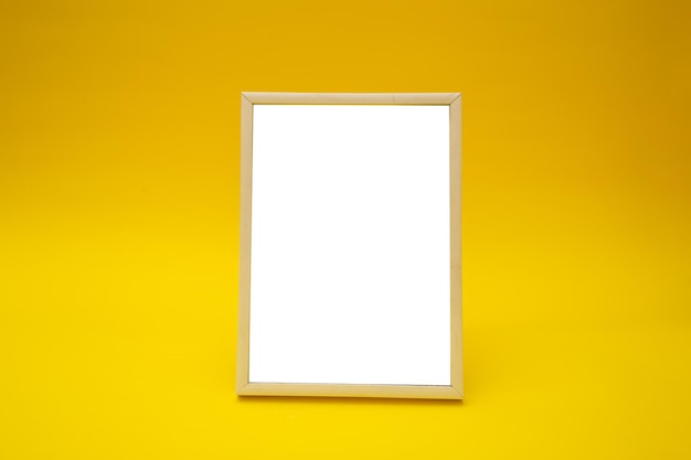 White photo frame on yellow background