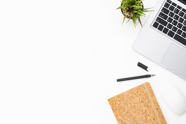 White photographer desk with laptop computer and office supplies. Top view, flat lay background with copyspace