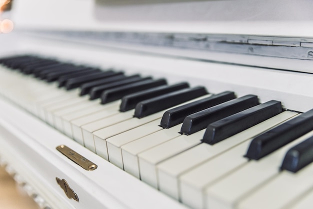 White piano close up keys go to perspective