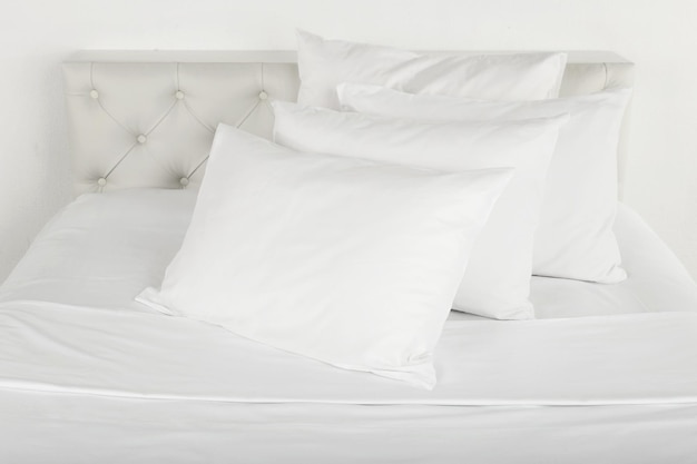 White pillows on bed in room