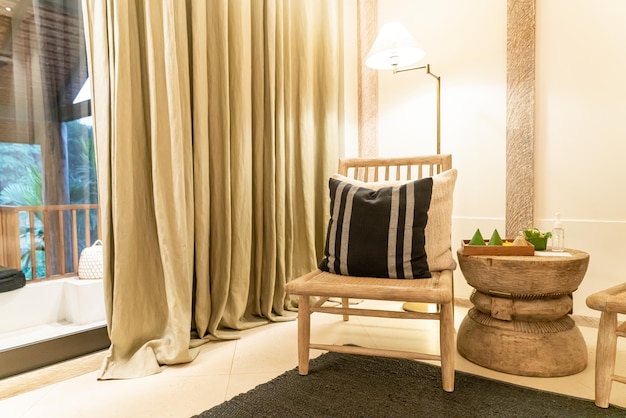 white pillows decorate on chair in luxury hotel resort living room and bedroom